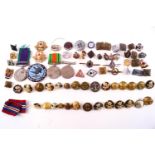 A group of assorted Militaria items including Buttons, Pips, Badges, the 1939 - 45 Medal,