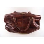 A leather Gladstone style holdall bag by Ben Lhachmi (Spanish) with brass fitting,
