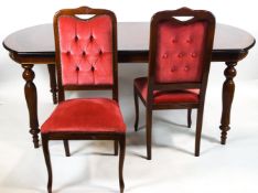 A mahogany and walnut cross banded D end dining table with central marquetry detailing