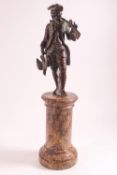 After the Antique, a bronze metal figure of a huntsman in 18th century costume,