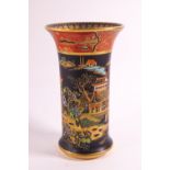 A 1920's Carlton ware spill vase, decorated win black and rust with kissing doves pattern,