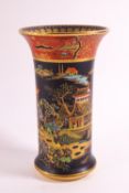 A 1920's Carlton ware spill vase, decorated win black and rust with kissing doves pattern,