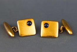 A yellow metal pair of chain and t-bar cufflinks.
