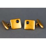 A yellow metal pair of chain and t-bar cufflinks.