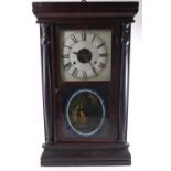 A Connecticut wall clock by Seth Thomas, set with a strike mechanism in a Roman dial,
