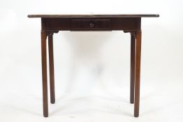 A mahogany swivel top tea table by Warings & Gillow Ltd and stamped to the drawer accordingly,