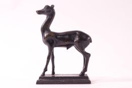A bronze model of a deer on rectangular base,