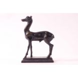 A bronze model of a deer on rectangular base,