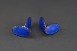 A pair of yellow metal and blue guilloche enamel double sided bar cufflinks by David Andersen,