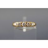 A yellow metal five stone graduated diamond ring. Approx 0.40ct Stamped 18ct.