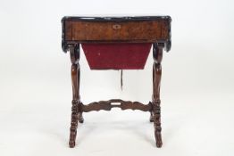 A Victorian burr walnut work table with shaped top with folding side over a plain fitted drawer