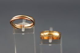 A yellow metal wedding ring, hallmarked 9ct gold, London, 1985,