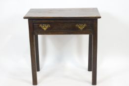 An elm wood late Georgian side table with rectangular top over a frieze drawer