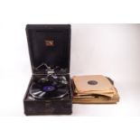 An HMV portable wind up gramophone, 15cm high x 29cm wide,
