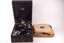 An HMV portable wind up gramophone, 15cm high x 29cm wide,