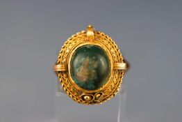 A Victorian yellow metal ring with green cabochon stone (Damaged - untested) Stamped 9ct. Size L