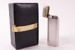 A Cartier brushed metal and gold finish gas lighter