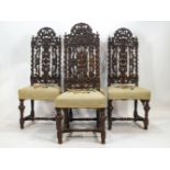 A set of four carved oak dining chairs in the style of Daniel Marot,