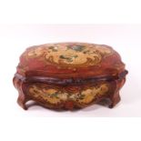 A Rococo style shaped and carved wood casket with domed lid,