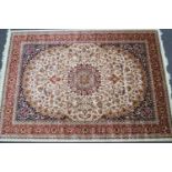 A machine woven Keshan style carpet with central medallion
