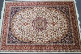 A machine woven Keshan style carpet with central medallion