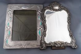 An Art Nouveau style photograph frame of portrait form,