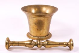 A brass pestle and mortar, or traditional form,