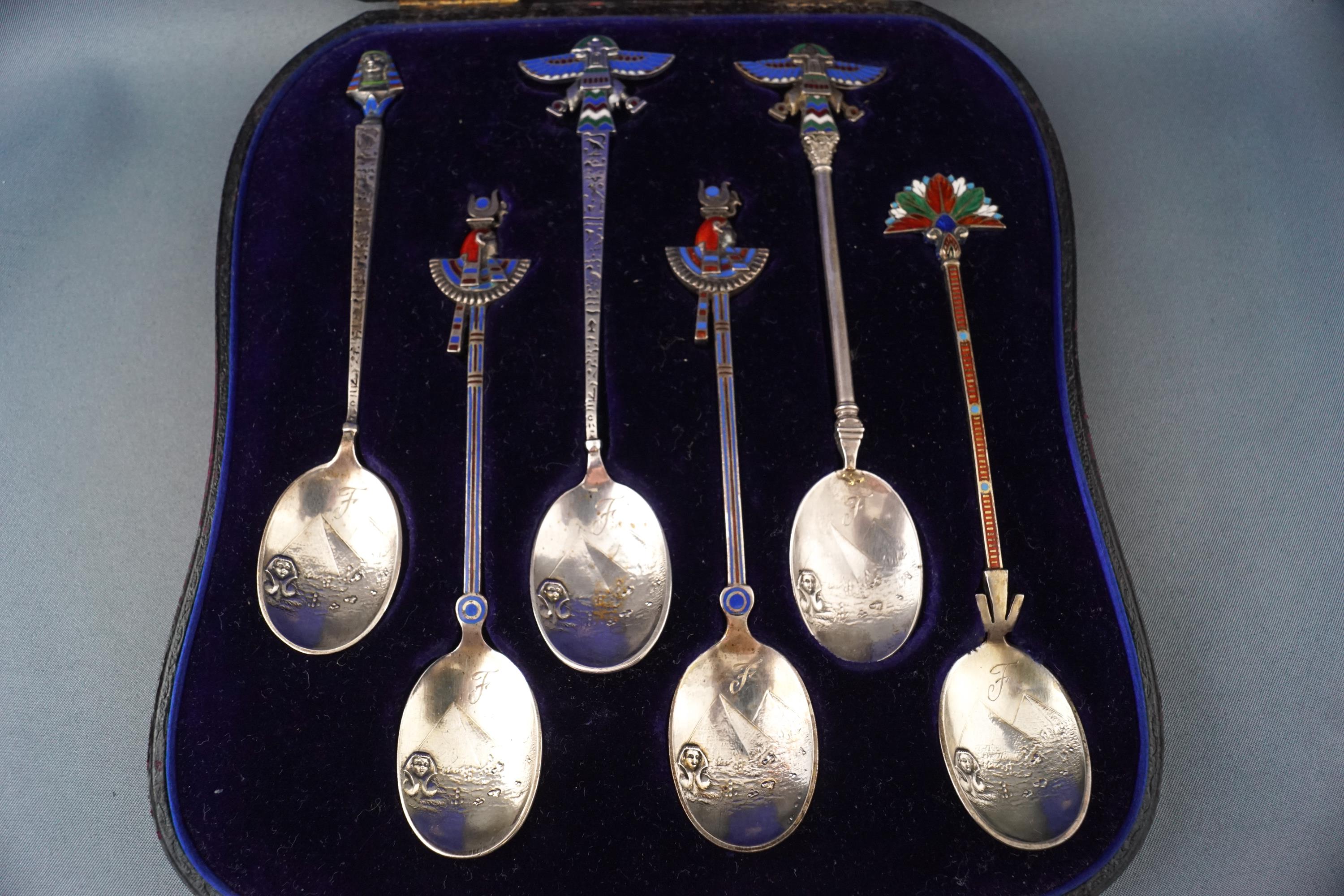 A cased set of six white metal Egyptian Revival enamelled tea spoons, - Image 2 of 2