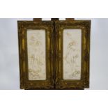 A gilt framed pair of composite marble panels of classical nymphs with purn 43cm x 15cm