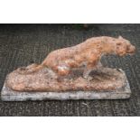 An ornamental garden composition stone figure of a lioness on rectangular base,
