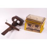 A 19th century wooden adjustable slide stereoscope with a selection of images,