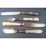 A fruit/dessert set with mother of pearl handles, engraved with strap work and floral motifs,