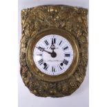 A French pressed brass Pendule D'Alcove clock decorated with fruiting vines and wheat sheafs