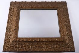 A rectangular mirror with moulded and later gold painted frame,