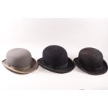 Two black and one grey bowler hat; one black by Semisize, marked 6 7/8, the other by Austin Reed....