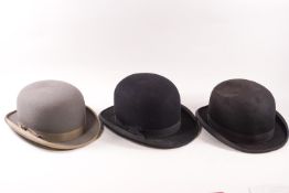 Two black and one grey bowler hat; one black by Semisize, marked 6 7/8, the other by Austin Reed....