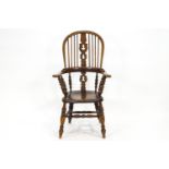 An elm and bentwood stick back chair with pierced splat over shaped arms on bobbin turned spindles,