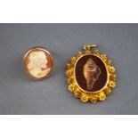 A yellow metal ring set with a carved cameo, size F, tested as 9ct gold.