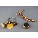 A collection of items to include a bloodstone and carnelian watch key, two seals...