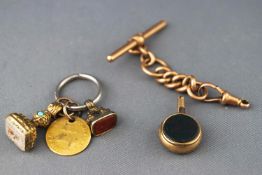 A collection of items to include a bloodstone and carnelian watch key, two seals...