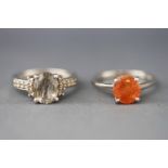 A selection of two dress rings each set with varieties of quartz.