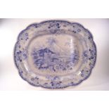 A large blue printed meat platter in the Genevese pattern,