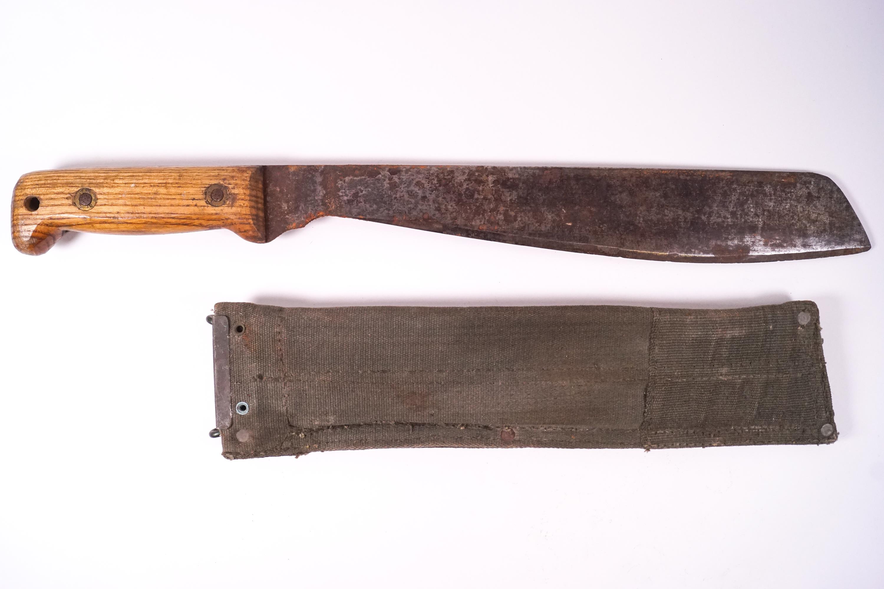 A British Army machete with sheath, numbered 4048 MECO 1956 KE 18732 to the sheath,
