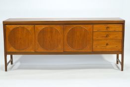 A teak sideboard with plain rectangular top over three plain fronted drawers and three doors,