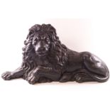 A Victorian cast iron figure of a recumbent lion,