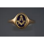 A yellow metal signet ring having a reversible spinning centre of plain and Masonic design