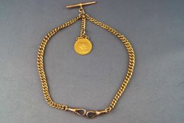 A yellow metal graduated curb double Albert chain with two swivel clasps and T-bar attachment.