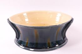 A Studio pottery bowl, by Kevin de Choisey with blue and yellow glaze, seal mark,