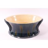 A Studio pottery bowl, by Kevin de Choisey with blue and yellow glaze, seal mark,