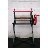 A Ewbank cast iron and painted mangle, on wheels,